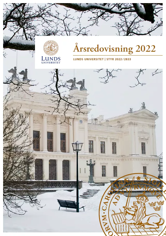 Framsidan på Lunds universitets årsredovisning. Visar universitetshuset på vintern.